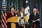 Secretary Chao, Commerce Secretary Carlos M. Gutierrez (center), and Treasury Secretary John W. Snow (right).