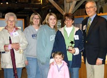 Mrs. Debra Deary and family accepted Tucker's Corridor Star from Commission Chair Ted Sanderson.