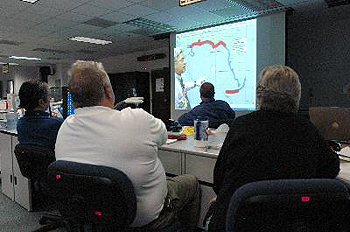 FEMA staff participate in the noon briefing from the National Hurricane Center in the Regional Response Coordination Center (RRCC) in Atlanta, GA. The RRCC is operating on a 24-hour schedule in preparation for the landfall of Hurricane Dennis. FEMA Photo/Mark Wolfe