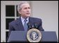 President George W. Bush is seen in the Rose Garden of the White House, Friday, Dec. 2, 2005, as he speaks on the growth of the economy with news of 215,000 jobs added for the month of November and third-quarter growth this year was 4.3 percent.  White House photo by Paul Morse