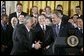 Shaking hands with manager Jack McKeon, President George W. Bush hosts a visit by the 2003 World Series Champions, the Florida Marlins, to the White House Friday, Jan. 23, 2004.  White House photo by Paul Morse