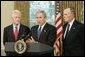 Standing with former Presidents Bill Clinton and George H. W. Bush, President George W. Bush discusses the plans to help people affected by Hurricane Katrina in the Oval Office Sept. 1, 2005. "We're working hard to repair the breaches in the levees. Federal, state, and local agencies are also cooperating to sustain life," President Bush. "That means getting food and water to those who are stranded. Medical personnel and local officials are helping hospital patients and people gathered in the Superdome to evacuate."  White House photo by Paul Morse