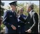 During the Armed Forces Farewell Tribute in Honor of General Richard B. Myers and Armed Forces Hail in Honor of General Peter Pace at Fort Myer's Summerall Field in Ft. Myer, Va., Friday, Sept. 30, 2005, President George W. Bush thanks General Richard B. Myers, with wife Mary Jo Myers, for his service as Chairman of the Joint Chiefs of Staff. White House photo by Paul Morse