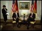 President George W. Bush talks with German Chancellor Gerhard Schroeder during a series of United Nations meetings with world leaders in New York Wednesday, Sept. 24, 2003. After the meeting, the two leaders addressed the media. "We're both committed to freedom; we're both committed to peace; we're both committed to the prosperity of our people," said President Bush.  White House photo by Paul Morse