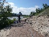 walkway with construction workers next ro a river