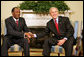 President George W. Bush shakes hands with Burkina Faso President Blaise Compaore, during a meeting Wednesday, July 16, 2008, in the Oval Office of the White House. White House photo by Joyce N. Boghosian