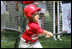 A player for the Cramer Hill Little League Rex Sox of Camden, N.J. hits the ball during the season opening game of the 2008 Tee Ball on the South Lawn Monday, June 30, 2008, on the South Lawn of the White House playing against the Jose M. Rodriguez Little League Angels of Manatí, Puerto Rico.