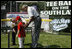  President George W. Bush and Hall of Famer Frank Robinson offer words of encouragement to 8-year-old Shelby Shayler of the Little League Challenger Division in Norfolk, Va., Wednesday, July 16, 2008, as she places a ball on the tee to start the first game of a doubleheader on the South Lawn of the White House.