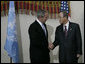 President George W. Bush is greeted Tuesday, Sept. 25, 2007, by United Nations Secretary-General Ban Ki-moon after arriving at U.N. Headquarters in New York City. White House photo by Eric Draper