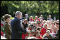 Standing with Mrs. Laura Bush, President George W. Bush addresses military support organizations Tuesday, Sept. 18, 2007, on the South Lawn. "Laura and I welcome the families who have got a loved one overseas, whether it be in Iraq or Afghanistan, fighting these extremists and terrorists," said President Bush. "The best way to honor your loved one is to make sure that he or she has the full support of the United States government as you accomplish the mission that we have set." White House photo by David Bohrer