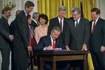 President George W. Bush signs the Trade Act of 2002 in the East Room Tuesday, Aug. 6. "With trade promotion authority, the trade agreements I negotiate will have an up-or-down vote in Congress, giving other countries the confidence to negotiate with us," said the President in his remarks.  White House photo by Tina Hager