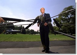 President George W. Bush speaks to the media before departing the White House Friday afternoon, August 2, 2002. White House photo by Eric Draper.