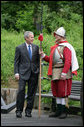 President George W. Bush stands with an actor in period garb Sunday during a tour of the Jamestown Settlement, in Jamestown, Va. The President and Mrs. Bush joined the celebration honoring the 400th anniversary of the settlement, receiving lessons in sail making and visiting the archaeological dig. White House photo by Eric Draper