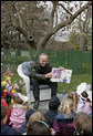 Interior Secretary Dirk Kempthorne reads the children's book, "Officer Buckle and Gloria," by Peggy Rathmann during the 2007 White House Easter Egg Roll on the South Lawn. White House photo by Shealah Craighead