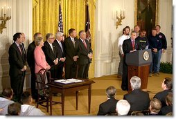 President George W. Bush speaks during the signing of the Terrorism Risk Insurance Act in the East Room, Tuesday, Nov. 26. "The Terrorism Risk Insurance Act will provide coverage for catastrophic losses from potential terrorist attacks. Should terrorists strike America again, we have a system in place to address financial losses and get our economy back on its feet as quickly as possible," said the President.  White House photo by Paul Morse