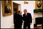 President George W. Bush welcomes Romanian President Ion Iliescu to the Oval Office Tuesday, Oct. 28, 2003. White House photo by Tina Hager.