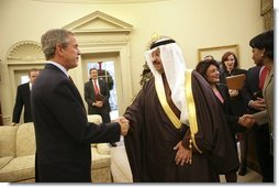 President George W. Bush shakes hands with interim Iraqi President Ghazi Al-Yawer at the end of their meeting in the Oval, Monday, Dec. 6, 2004.  White House photo by Eric Draper