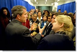 President George W. Bush meets with participants of the women's entrepreneurship in the 21st Century Summit at the Ronald Reagan Building and International Trade Center, Washington, D.C., Tuesday, March 19. During his visit, the President unveiled plans to help small businesses across the country. "You can dream big dreams in America, and my job as the President is to make sure that if you've got a good idea, you can realize those dreams," said the President.  White House photo by Paul Morse