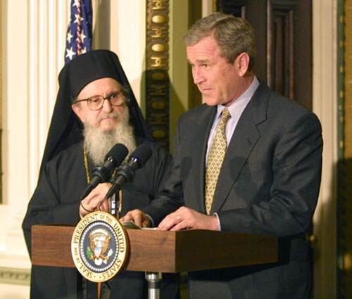 President Bush speaks with leaders of the Greek community in the White House.