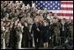 During a Feb. 23, 2005, visit to Wiesbaden Army Air Field in Wiesbaden, Germany, President George W. Bush and Laura Bush are welcomed by applause from U.S. troops. White House photo by Paul Morse