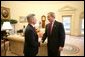 President George W. Bush greets Veterans Affairs Secretary Jim Nicholson in the Oval Office, Friday, Feb. 18, 2005. Secretary Nicholson was sworn into office Feb. 1, 2005. White House photo by Eric Draper