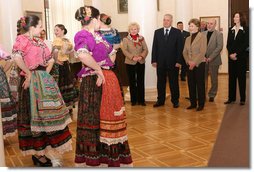 Mrs. Laura Bush stands with Sochi Mayor Viktor Kolodyazhny as they listen to the Russian singing group "Lubo," during a visit Sunday, April 6, 2008, to the Sochi Art Museum. With them at left is Mrs. Svetlana Ushakova, spouse of Yury Ushakov, Russian Ambassador to the United States. White House photo by Shealah Craighead