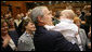 President George W. Bush holds the baby of a U.S. Embassy staff member in Prague Tuesday, June 5, 2007, during a visit to the embassy in the Czech Republic before leaving for Germany to attend the G8 Summit. White House photo by Eric Draper