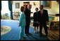 President George W. Bush and Laura Bush talk with former President Bill Clinton and Senator Hillary Clinton in the Blue Room shortly before the unveiling of the Clinton portraits in the East Room of the White House Monday, June 14, 2004. White House photo by Paul Morse