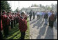 President George W. Bush conducts the Jagdhornblaser Baremerhagen Band after arriving in Trinwillershagen, Germany, for a barbeque dinner courtesy of Chancellor Angela Merkel. White House photo by Eric Draper