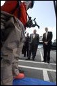 Vice President Dick Cheney and Department of Homeland Security Secretary Michael Chertoff watch a demonstration of an emergency worker donning protective gear during a visit to the Federal Law Enforcement Training Center in Glynco, Georgia, May 2, 2005. White House photo by David Bohrer