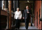 Chancellor Angela Merkel and President George W. Bush walk to their meeting after the arrival ceremony in Stralsund, Germany, Thursday, July 13, 2006. White House photo by Paul Morse