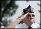 A Korean War veteran salutes during the singing of the National Anthem, Thursday, July 27, 2006 during the 2006 Korean War Veterans Armistice Day Ceremony held at the Korean War Memorial in Washington, D.C. Vice President Dick Cheney honored the veterans in an address and remembered fallen soldiers in a wreath laying ceremony at the memorial. White House photo by David Bohrer