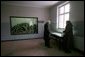 Standing in a room formerly used as barracks for Nazi prisoners, a museum guide explains to Vice President Dick Cheney about the atrocities committed there at the Auschwitz-1 Nazi concentration camp, near Krakow, Poland, Friday, Jan. 28, 2005. The window at left shows a display of empty cans of Zyklon-B gas used against former prisoners. Vice President Cheney was there to take part in ceremonies commemorating the 60th Anniversary of the liberation of the Auschwitz camps. White House photo by David Bohrer