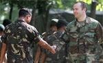 Military cooperation with partner nations is critical to defeat the terrorist enemy.  Here, an American soldier greets a Filipino soldier during a joint military exercise. [AP/WWP]