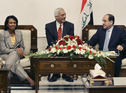 Secretary Rice meets with Iraq's Prime Minister Nouri al-Maliki, aided by a translator, center, in Baghdad, Iraq, Aug. 21, 2008. © AP Images