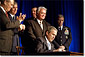 President George W. Bush signs a defense appropriations bill at the Pentagon, Jan., 10. Photographed with President Bush are Secretary of Defense Donald Rumsfeld (far left), Chairman of the Joint Chiefs of Staff General Richard Myers (center, left), House Armed Services Committee Chairman Rep. Bill Young (directly behind President Bush), Army Vice Chief of Staff Gen. John Keane (behind Mr. Young) and Air Force Vice Chief of Staff General Robert H. Foglesong (far right). White House photo by Paul Morse.