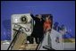 President George W. Bush and Laura Bush wave from Air Force One Tuesday, Nov. 15, 2005, after arriving at Osaka International Airport in Osaka, Japan.  White House photo by Paul Morse