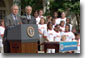 President Bush and Secretary of State Colin Powell hold a press conference about Powell's organization, America's Promise, in the Rose Garden July 9, 2001. White House photo by Moreen Ishikawa.