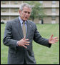 President George W. Bush gestures as he talks with members of the media following his lunch with U.S. Marines during his visit to The Basic School at Quantico Marine Corps Base Friday, Sept.14, 2007 in Quantico, Va. White House photo by Chris Greenberg