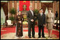 President George W. Bush and Mrs. Laura Bush join Viet President Nguyen Minh Triet and Mrs. Tran Thi Kim Chi in the Great Hall of the Presidential Palace Friday, Nov. 17, 2006, after arriving in Hanoi for the 2006 APEC Summit.  White House photo by Eric Draper