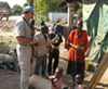 Gregory Germaine, Corrections Officer assigned to the UN Mission in Southern Sudan, with Sudanese children, Christmas morning. [Photo courtesy of Gregory Germaine, Dustin Boyd, and Pekko Aho]