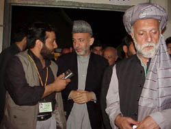 Chairman Karzai, being interviewed by a reporter Thursday night in Kabul. Mr. Karzai won more than 80 percent of the votes cast by delegates attending the Loya Jirga, or Grand Council, who voted yesterday to select the President of the Transitional Authority that will rule Afghanistan for the next two years. 