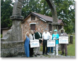 Friends of the Neosho National Fish Hatchery, MO gather to celebrate the restoration of an original stone arch.