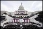 A sea of onlookers witness the second swearing-in ceremony of President George W. Bush at the U.S. Capitol Jan. 20, 2005. "From all of you, I have asked patience in the hard task of securing America, which you have granted in good measure," President Bush said. "Our country has accepted obligations that are difficult to fulfill, and would be dishonorable to abandon. Yet because we have acted in the great liberating tradition of this nation, tens of millions have achieved their freedom."  White House photo by Paul Morse