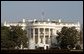 Honoring the seven astronauts who lost their lives aboard the Space Shuttle Columbia on Saturday, Feb. 1, 2003, the American flag continues to be flown at half-staff over the White House Monday, Feb. 3. President George W. Bush has directed the government to fly the flag at half-staff through Wednesday, Feb. 5.  White House photo by Paul Morse