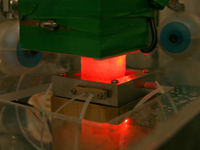 Photo of an ice core sample sitting on a melter head.