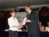 Dessislava Simeonova, Project Coordinator of the Bulgarian Helsinki Committee, receives a certificate for her organization's grant award from Acting USAID/Bulgaria Mission Director Gene Gibson