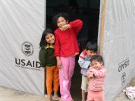 Peruvian children gather at an OFDA temporary shelter.