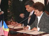 First Deputy Prime Minister Zinaida Greceanii and USAID Mission Director Earl Gast sign the MCC Threshold Agreement