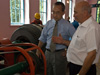 Avtandil Cholokava (right), head of the Kabali hydropower station, gives USAID Senior Deputy Assistant Administrator for Europe and Eurasia Ken Yamashita (left) a tour of the plant. Through USAID assistance, the plant has tripled its electrical generation capacity--enough to power 3,000 households.